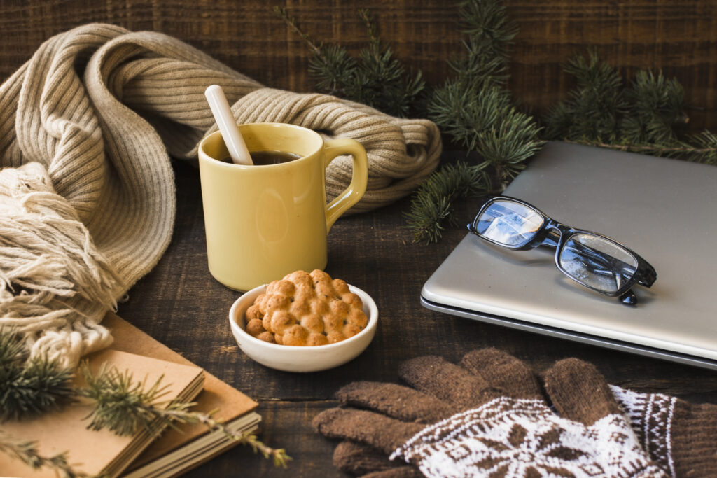 Hot drink near laptop in a cozy home office setup