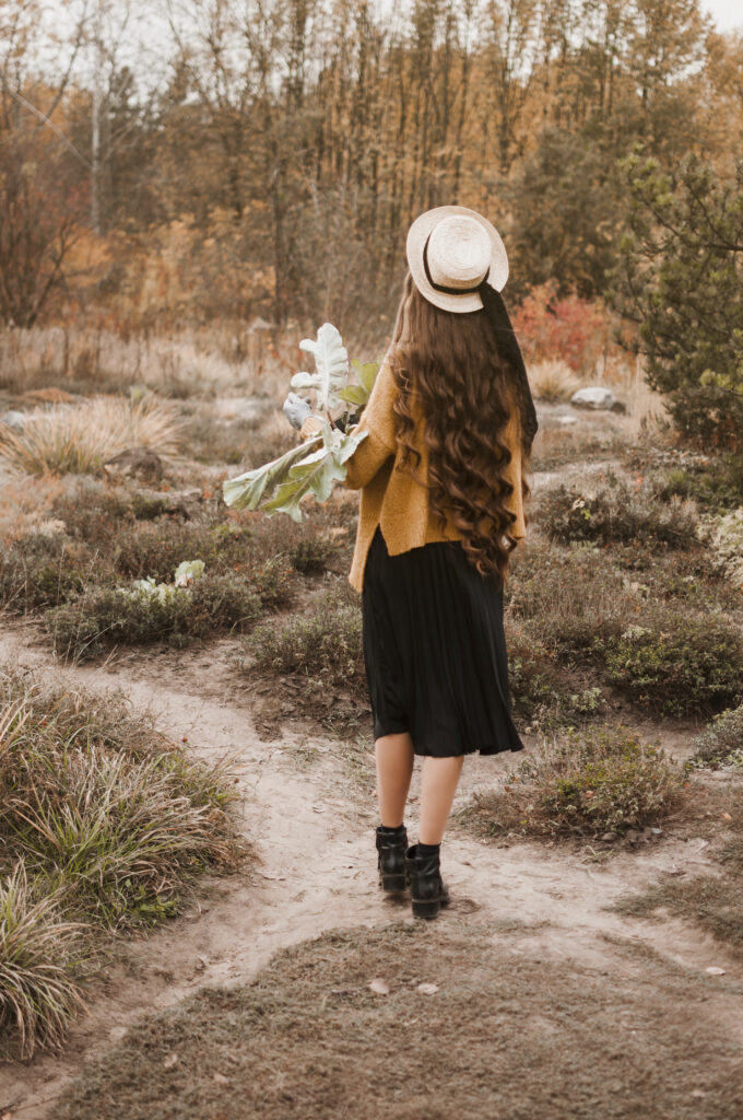 Girl with flowers on hand.